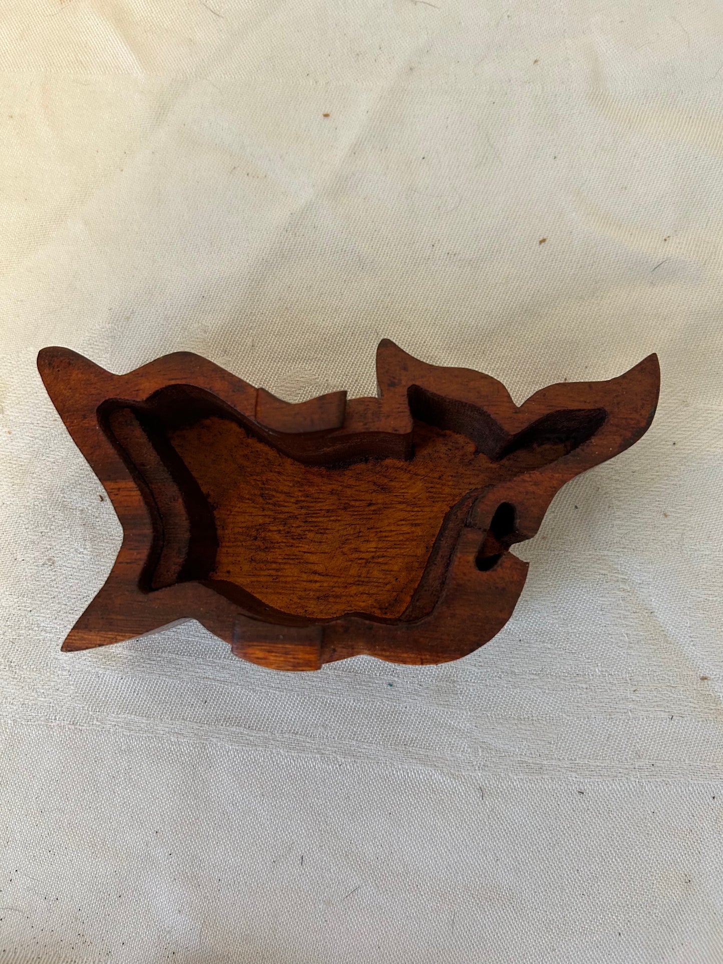 Inside of the wooden Dolphin Puzzle Box