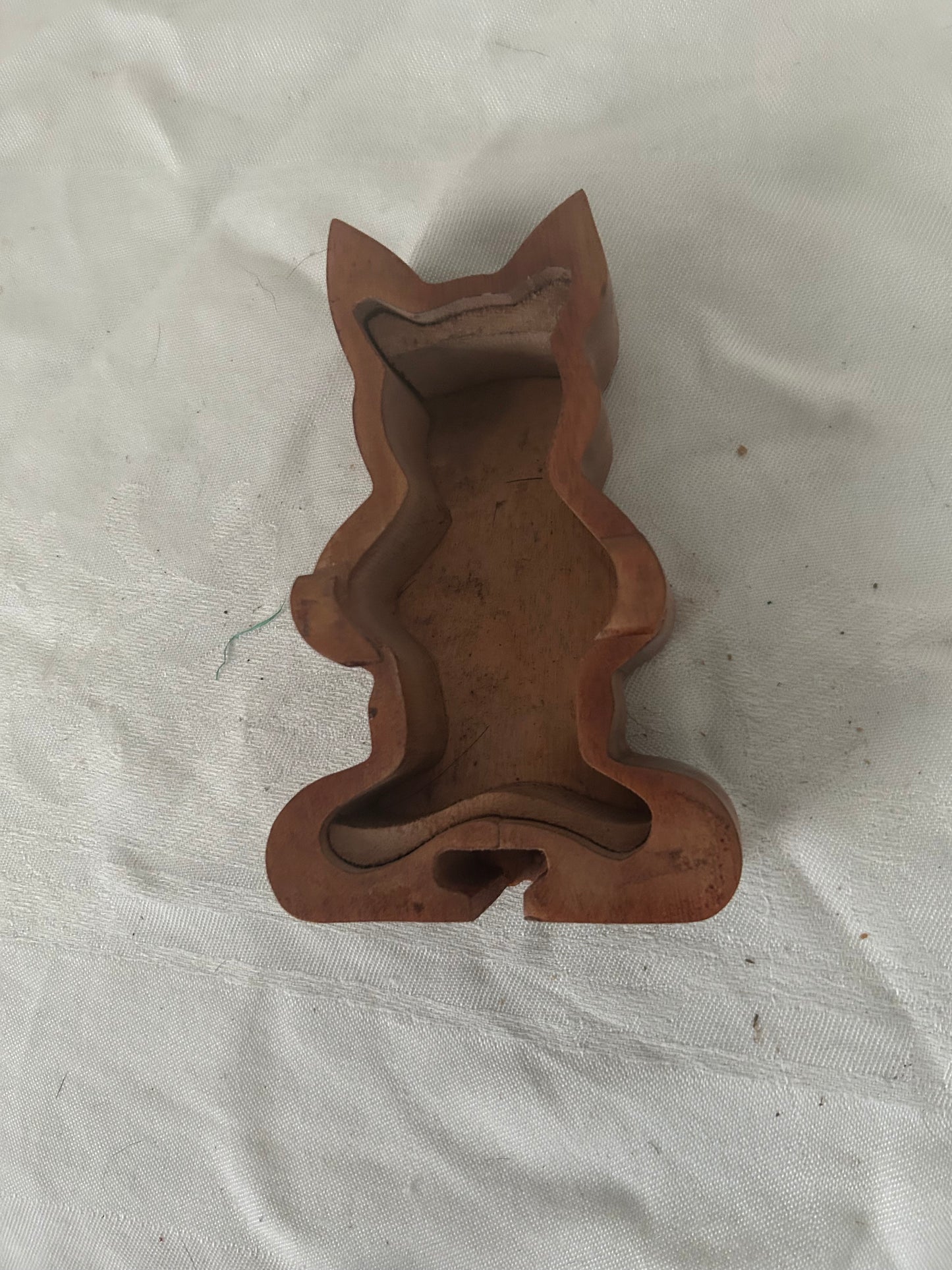 Inside the wooden cat puzzle box
