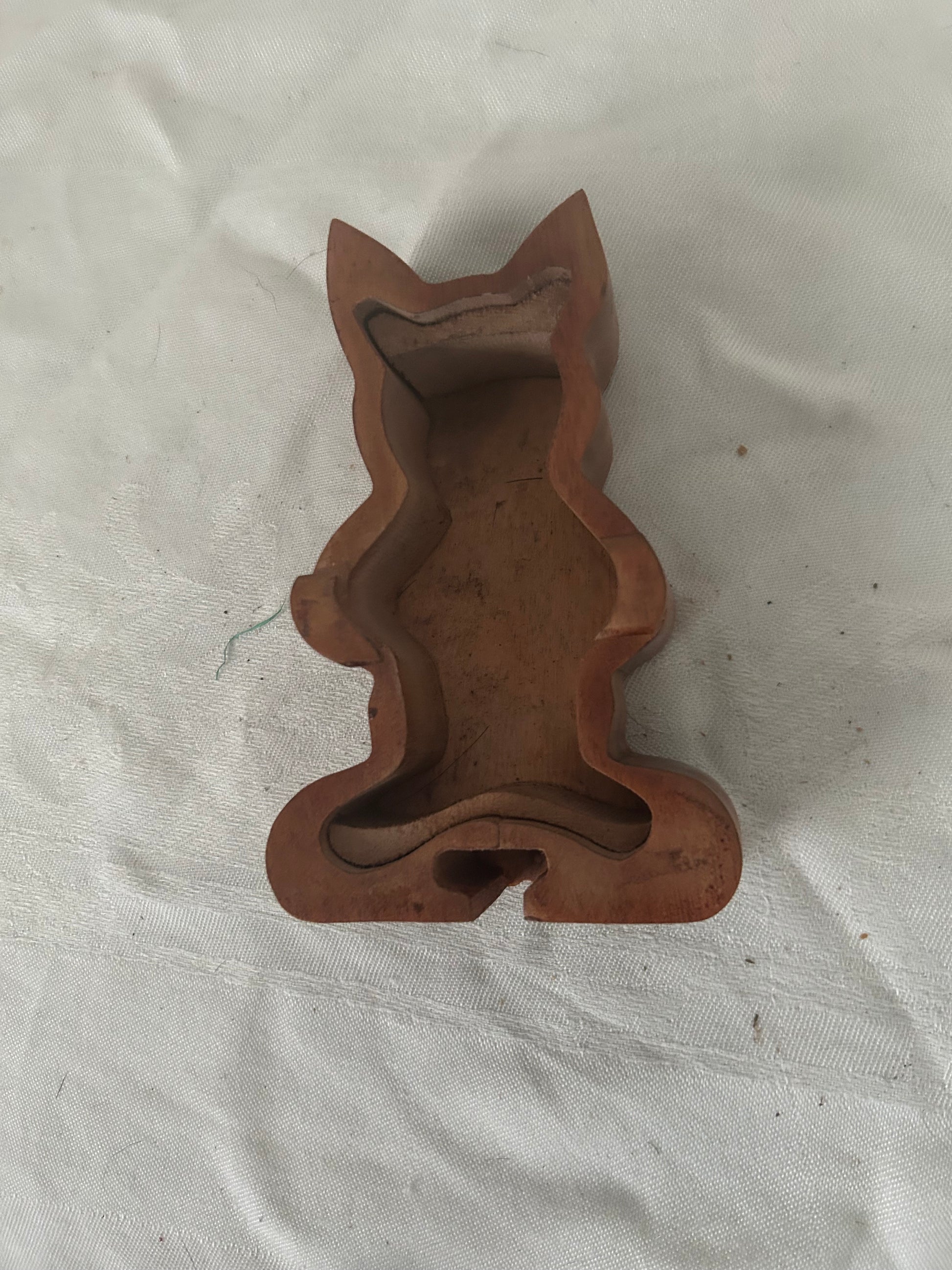 Inside the wooden cat puzzle box