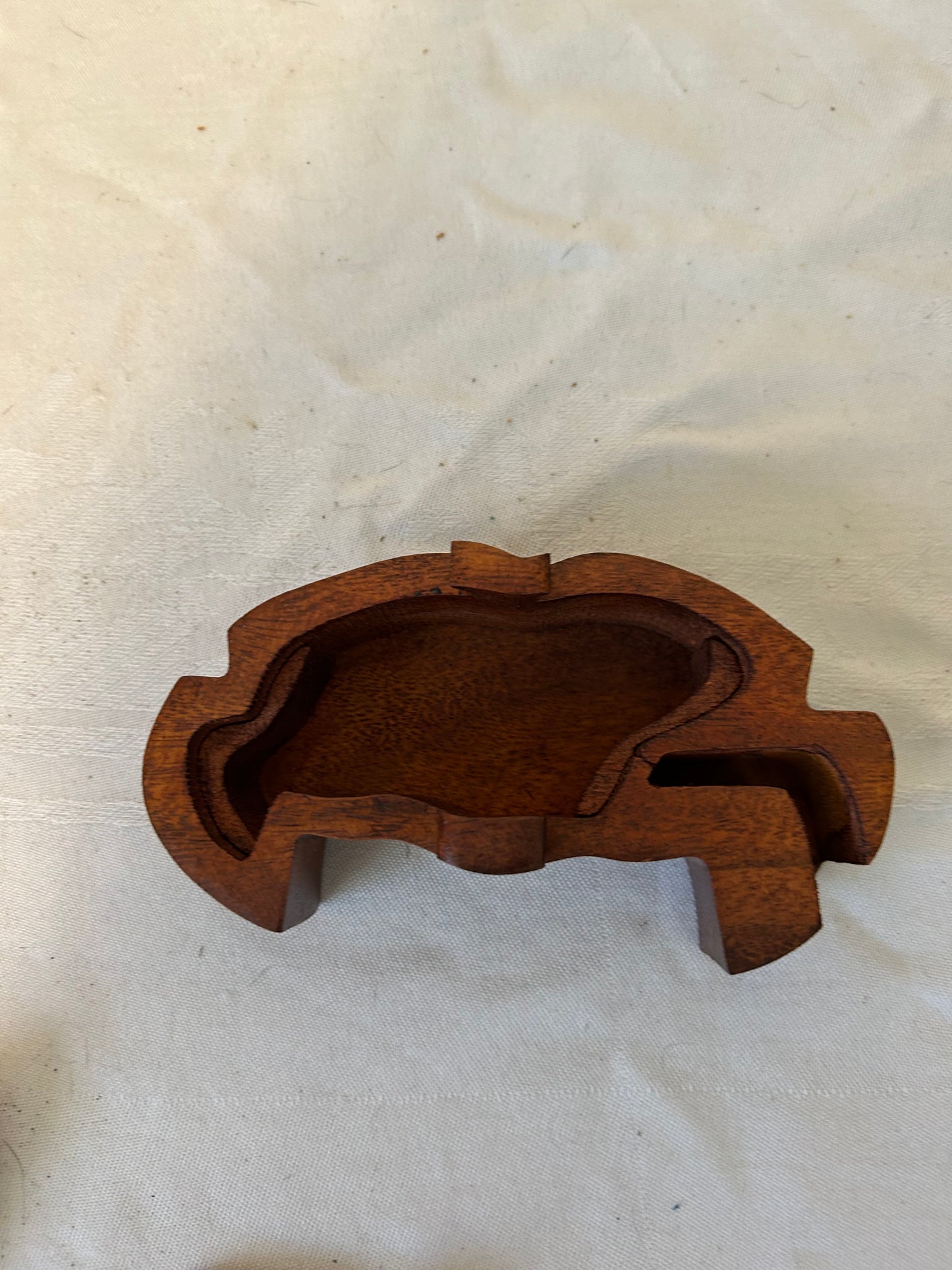 Wooden Crab shape puzzle with a unique design on a white fabric background